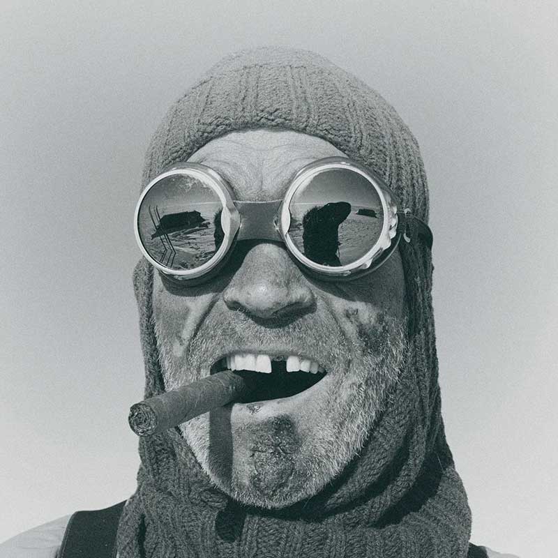 Lieutenant Colonel Henry Worsley, OBE, British explorer and British Army officer smoking a cigar wearing goggles.