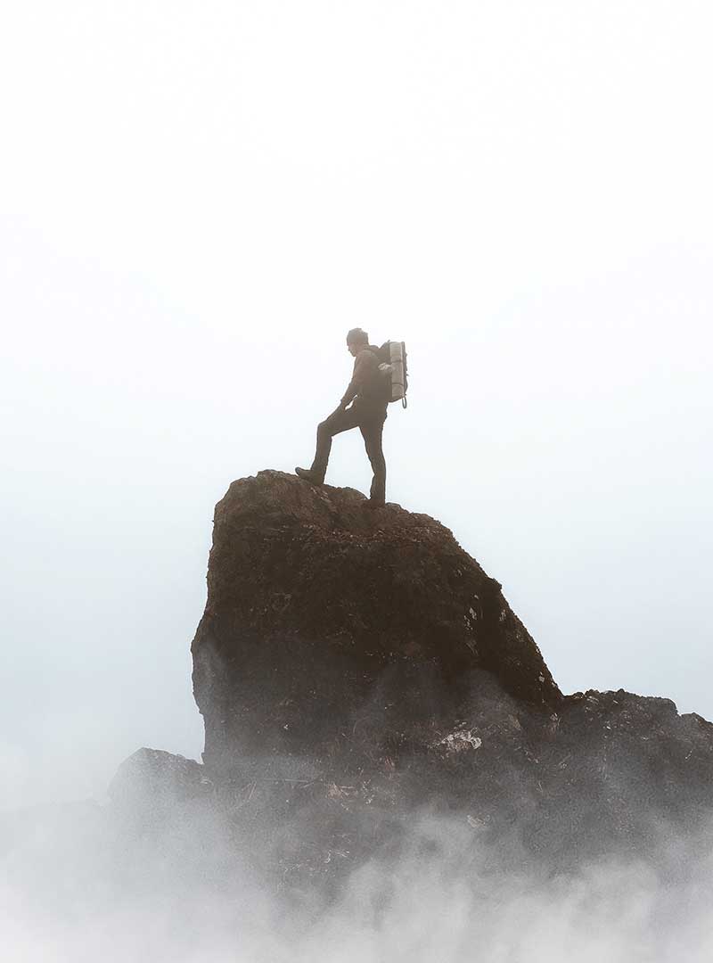 Male hiker on mountain top travelling quotes