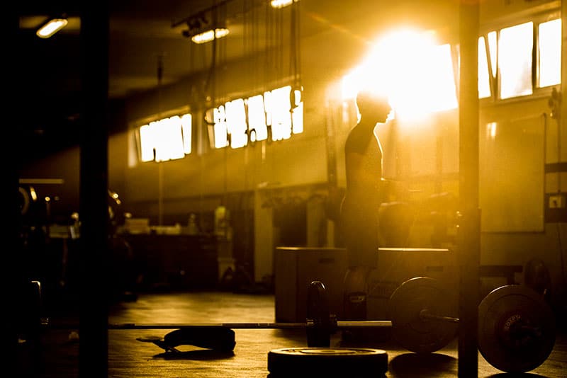 Athlete in gym with light