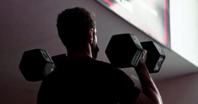 Dumbbell Thruster performed by man