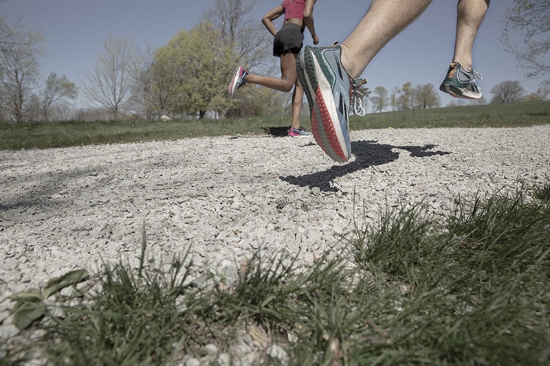Runners on a track wearing Reebok