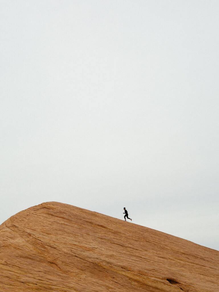 Runner on sand dune