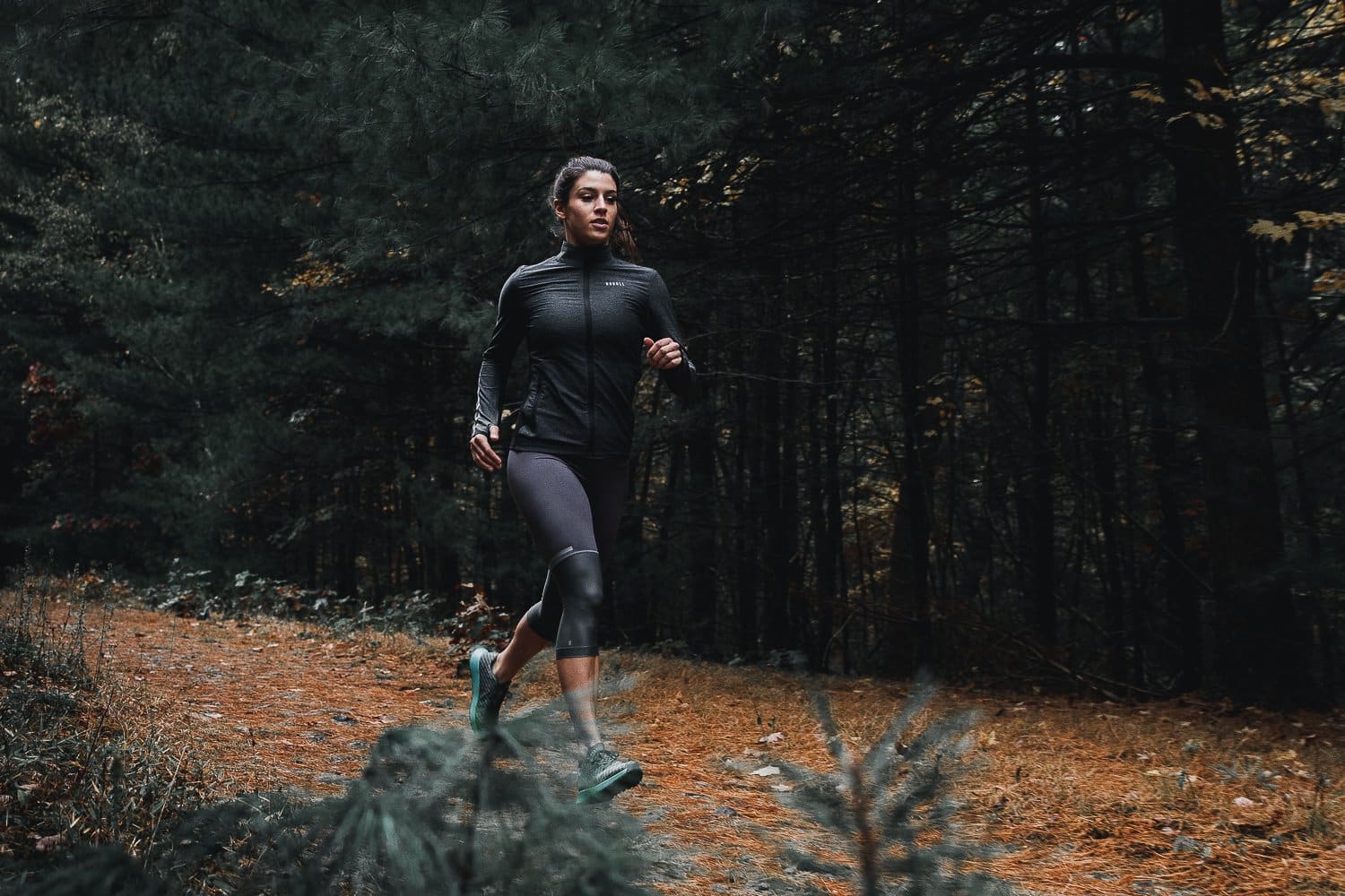 woman running in the woods