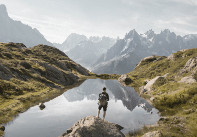 Man outdoors in mountains next to lake adventure