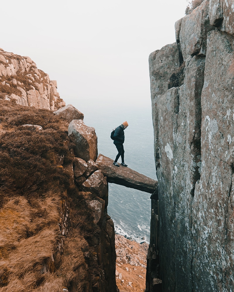 Man outdoors on a Rock near the sea