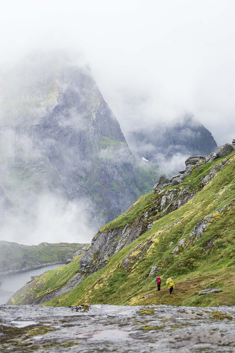 Green mountains with hikers