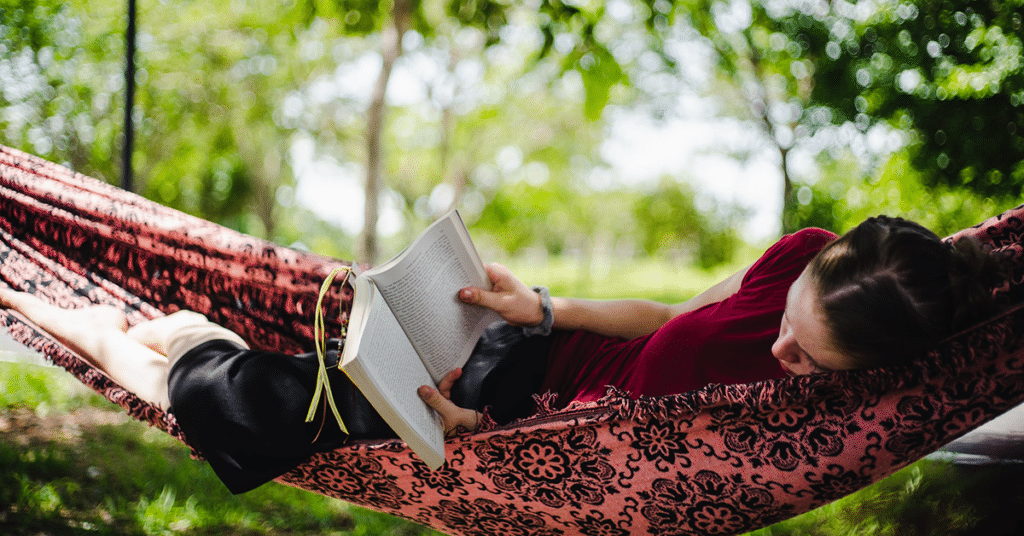 reading adventure books in a hammock