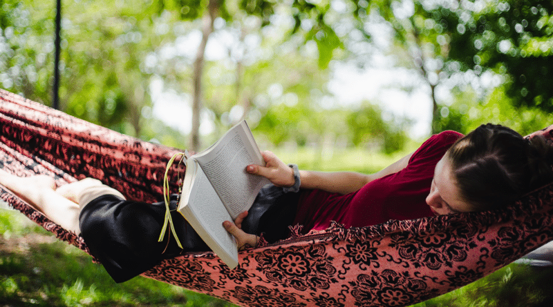 reading adventure books in a hammock