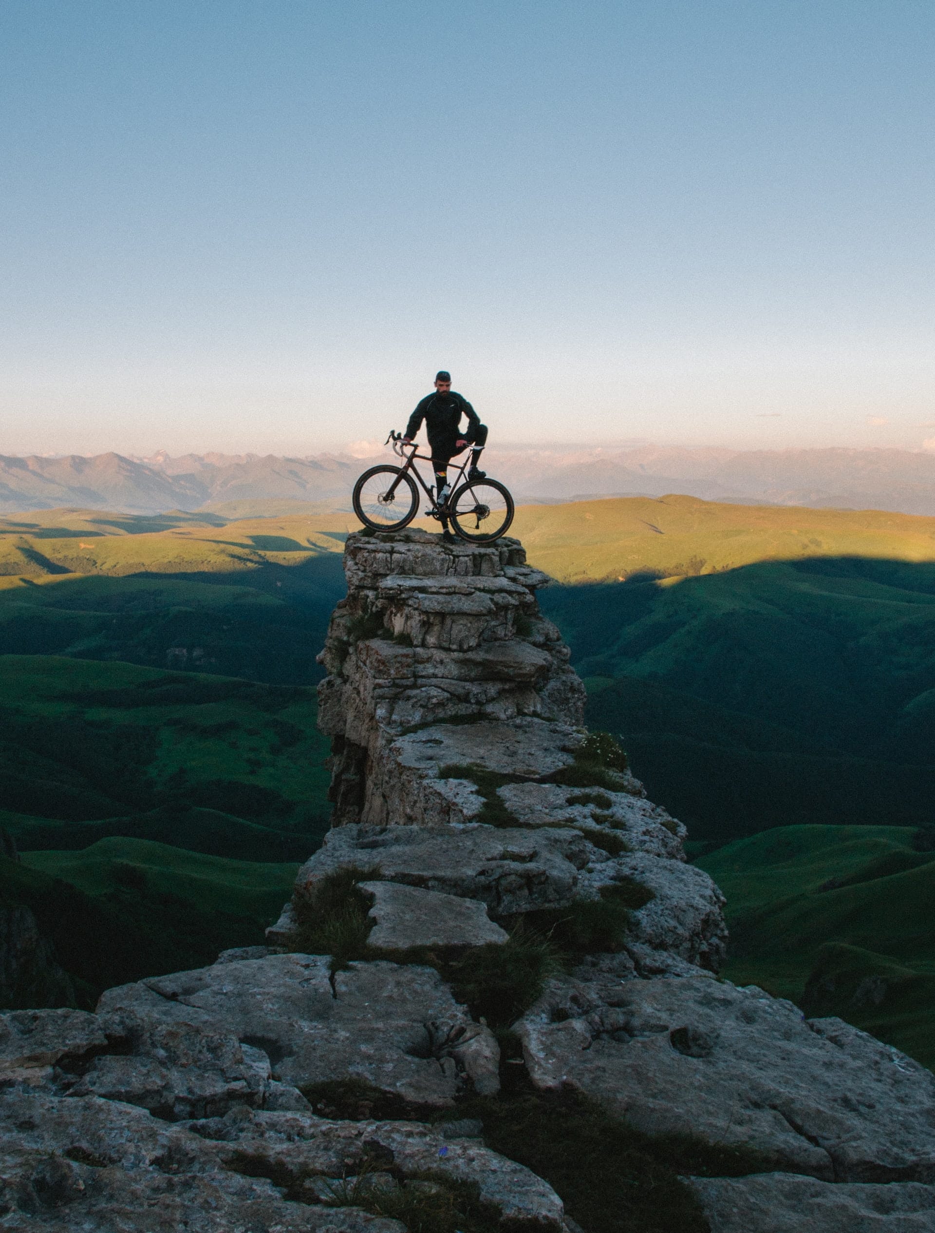 Man on bike on rock stack