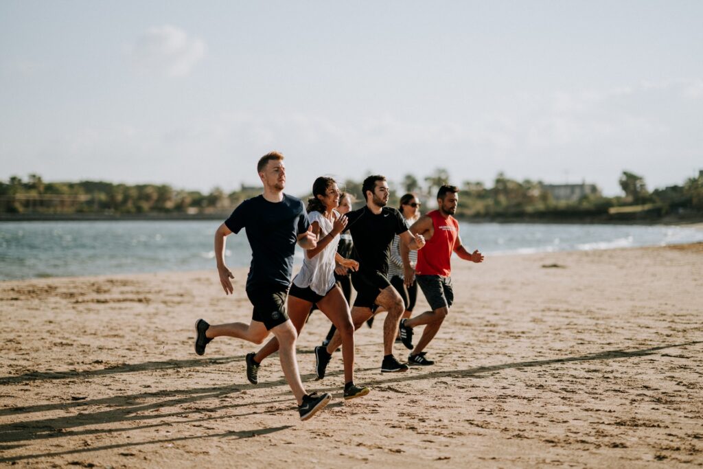 People running on the sand