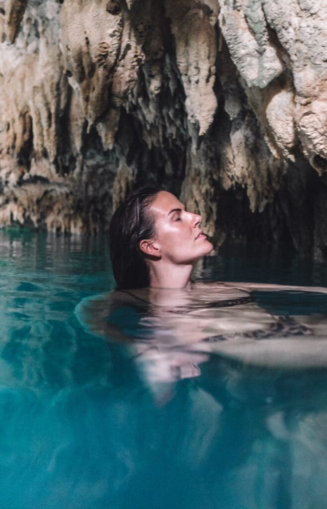 wild swimming in cave with woman