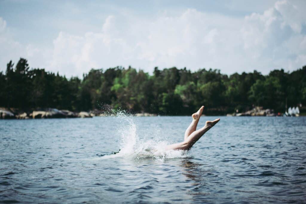 Woman diving into lake