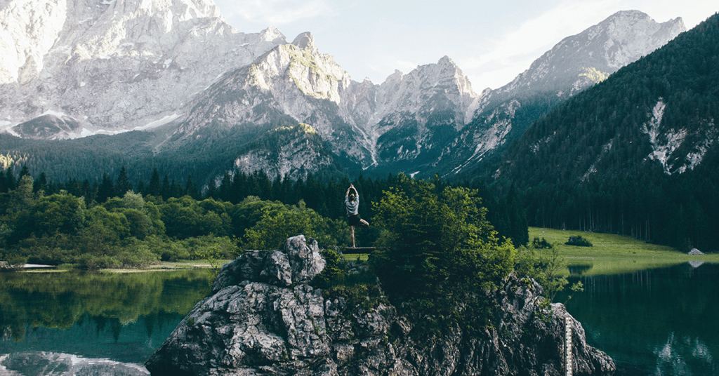 Woman-Meditating-on-a-Rock