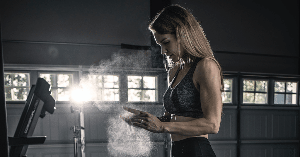 Woman about to perform face pulls