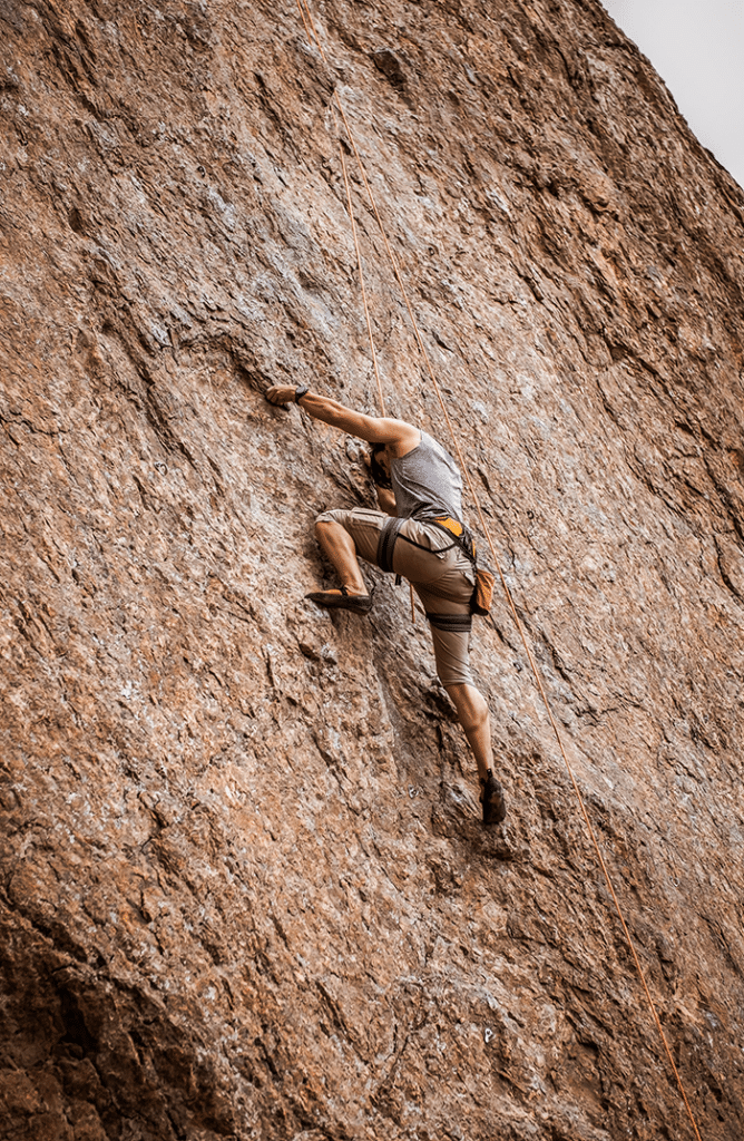 Man climbing on rock wall