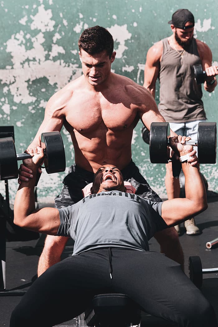 Man performing dumbbell bench press