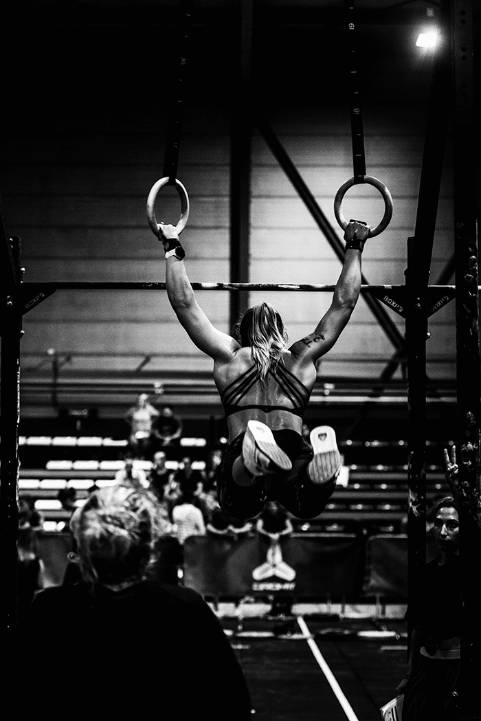 Woman performing muscle ups