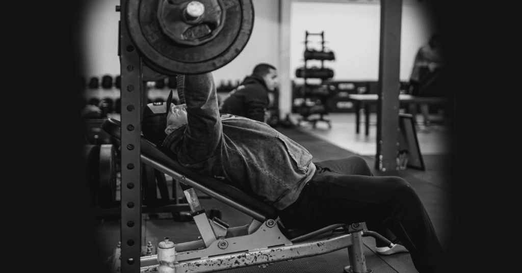 Man in gym on bench press