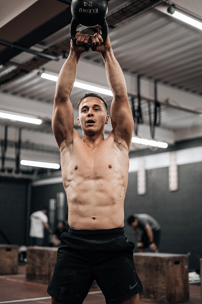 man with kettlebell in gym