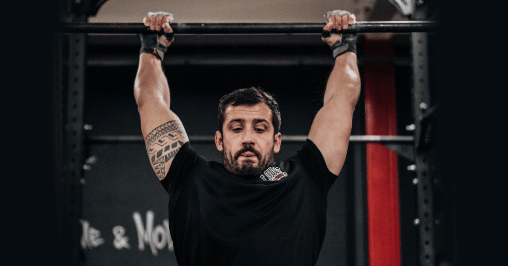 Athlete-on-Bar-Swinging-in-Gym