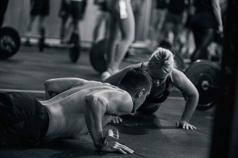 Athletes working out together in gym. 