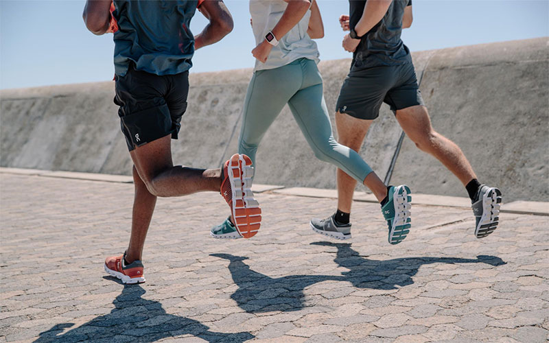 People running on pavement