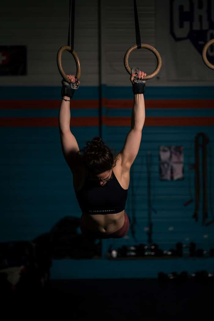 Woman doing muscle ups.