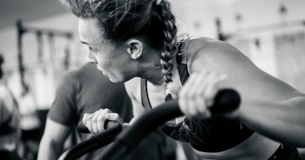 Woman during assault bike workouts