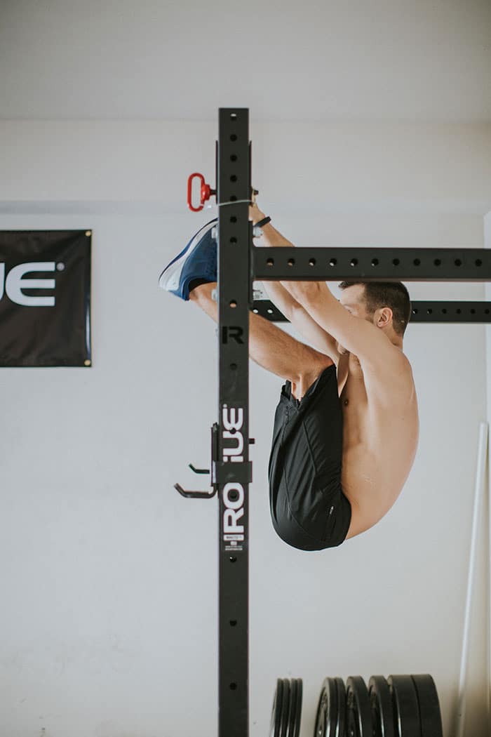 Man on Rogue Fitness rig