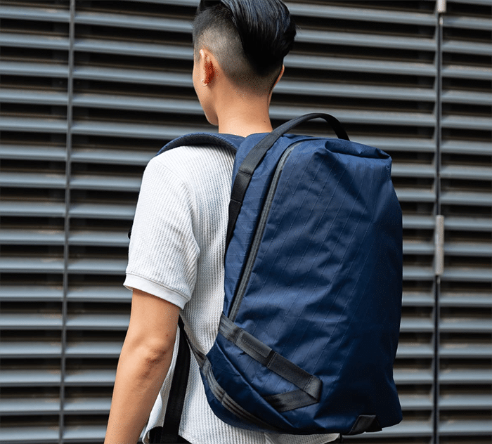 Man with backpack in street