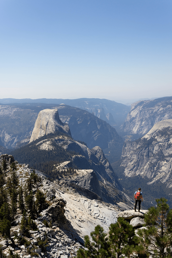 man comparing stats about hiking in the usa