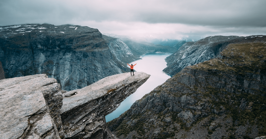 Man-on-Mountain-with-Orange-Jacket