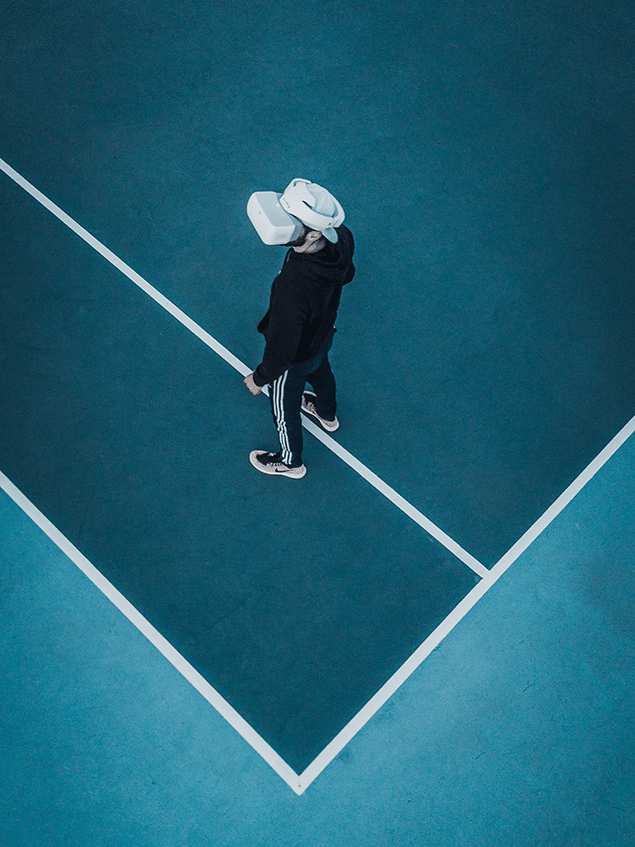 Man on sports court wearing vr headset