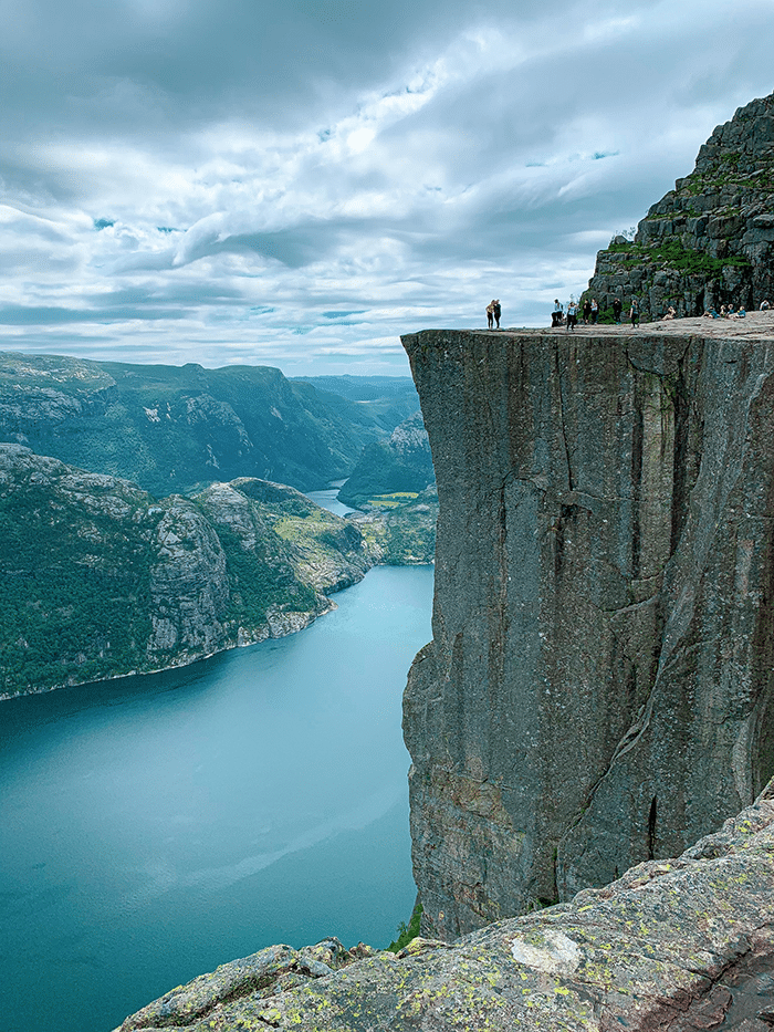 People on top of mountain in Norway. 