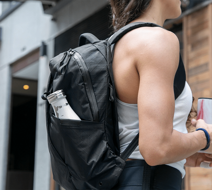 Woman with thirteen backpack