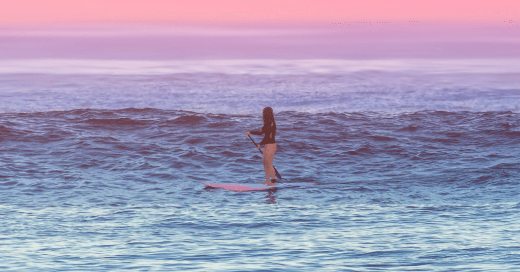 Woman doing workout on paddleboard