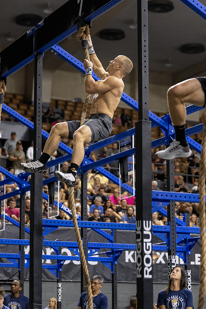 Scott Panchik climbing a rope wearing F-LITE 260 legacy edition