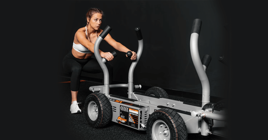 Woman working with Torque Fitness Tank sleds