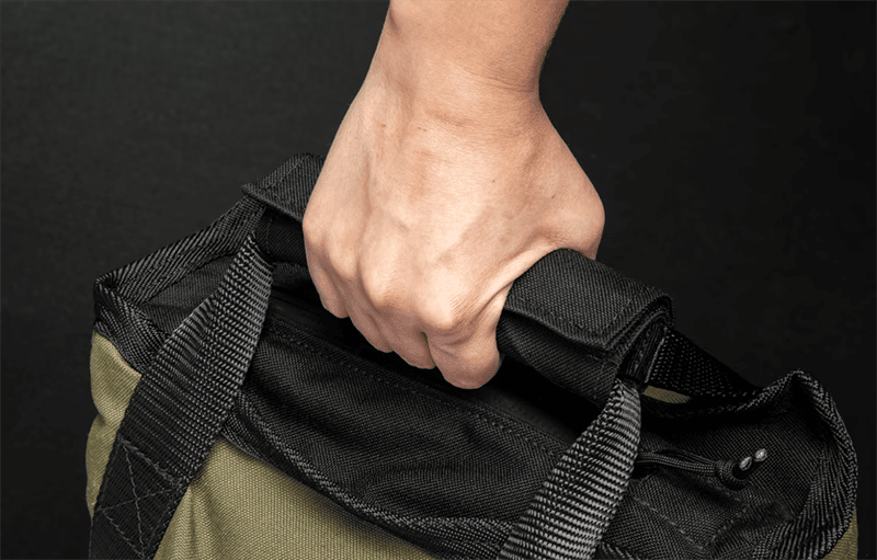 Rogue Jerry Can Sandbag with person gripping handle
