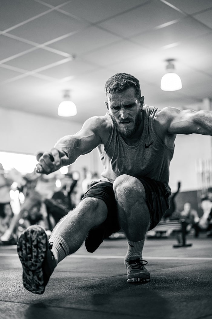 Man squatting during competition