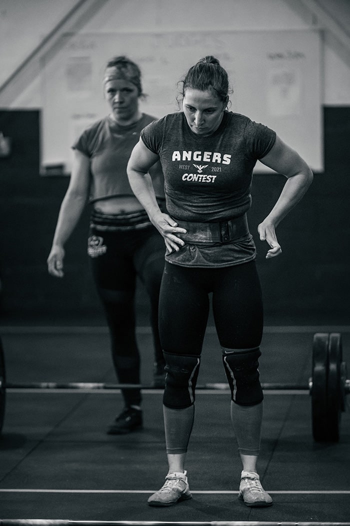 Woman before curtsy squat