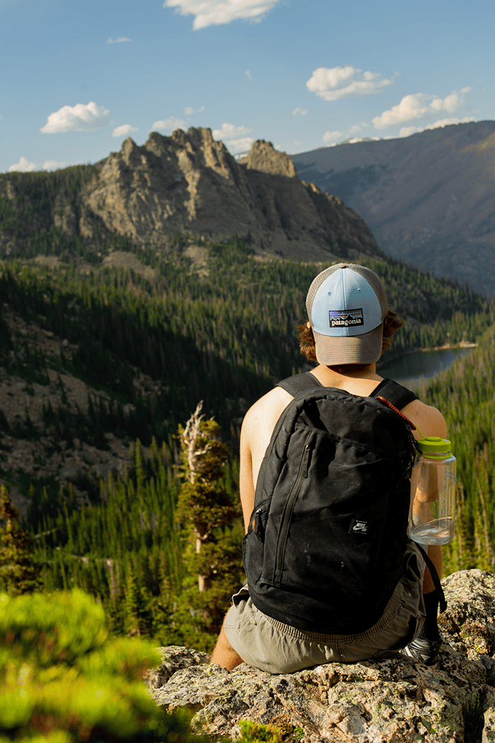 Man in patagonia hat in nature