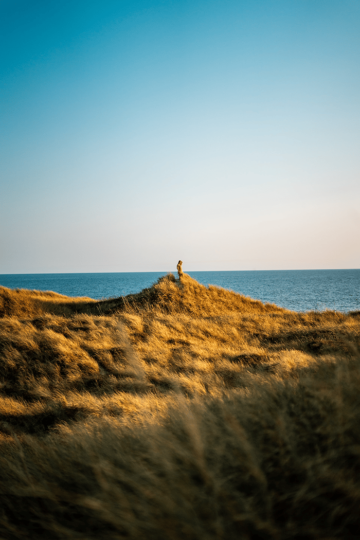 Woman walking by the sea