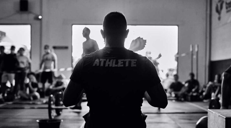 man in gym in black and white
