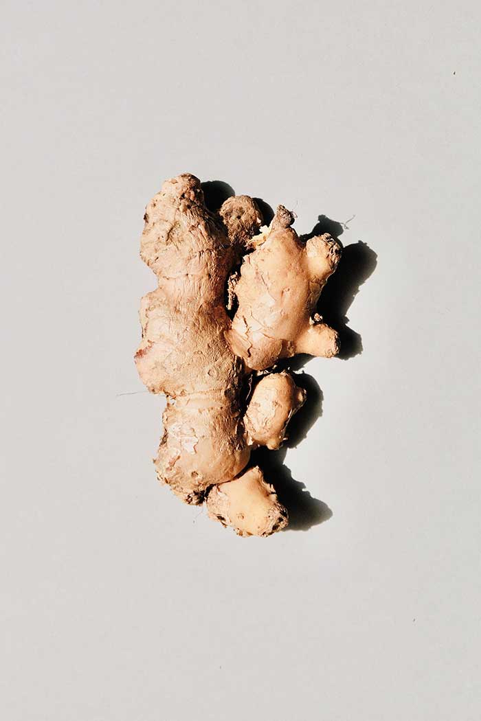 Health benefits of ginger on grey background