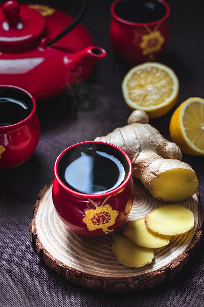 Ginger tea on wooden base