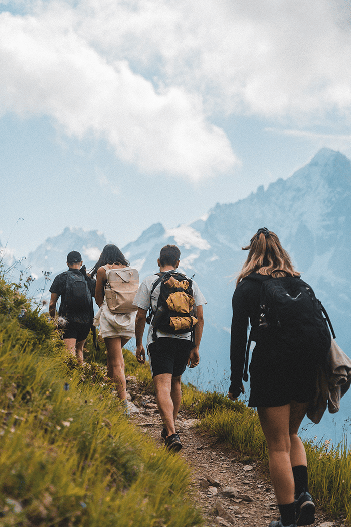 Hikers in a line on a trail