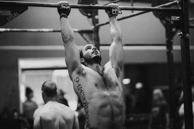 Man doing pull ups on bar