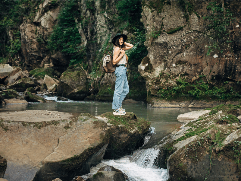 UK hiker poses by the river 