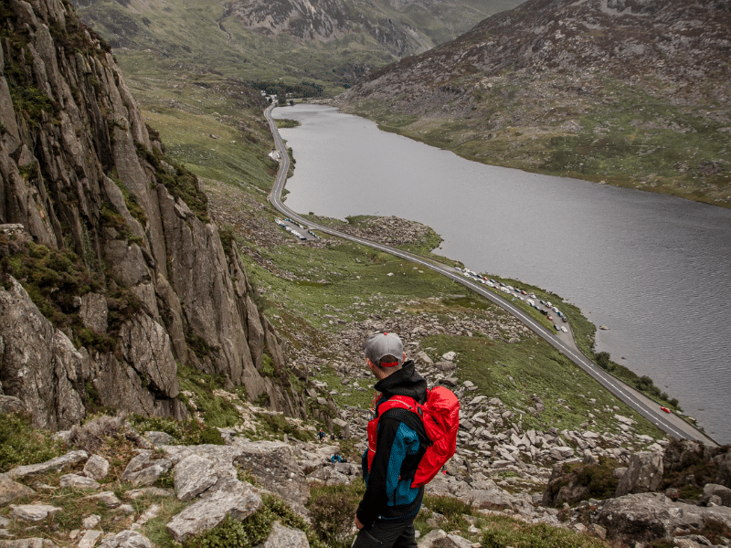 UK hiker looks out over a lake